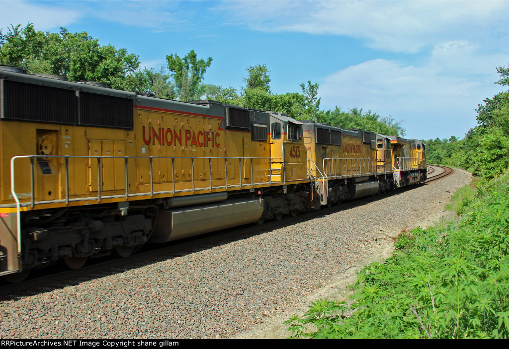 UP 8023 Heads off EB with a stack train.